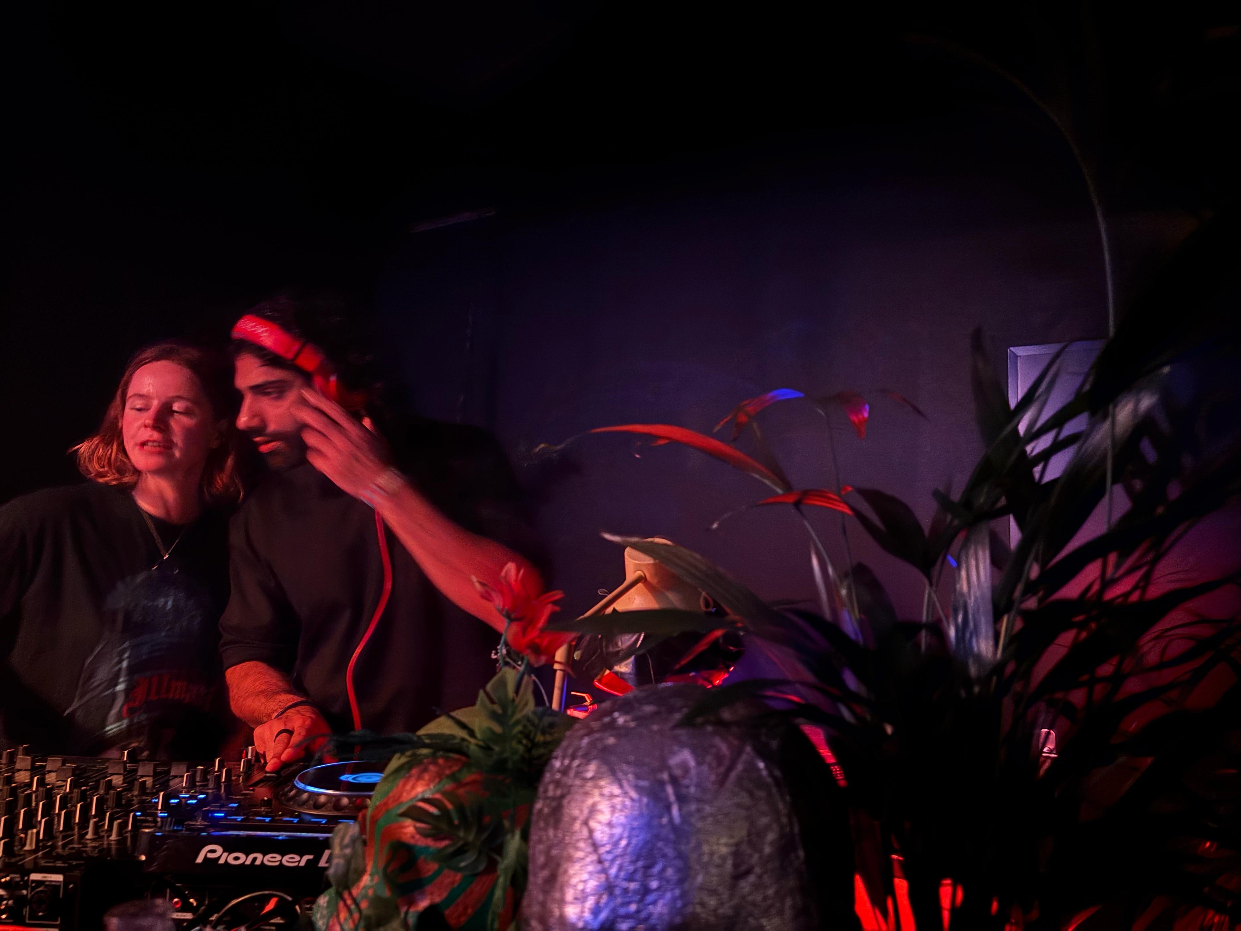 Fawad Javaid DJ set with plants and red lighting