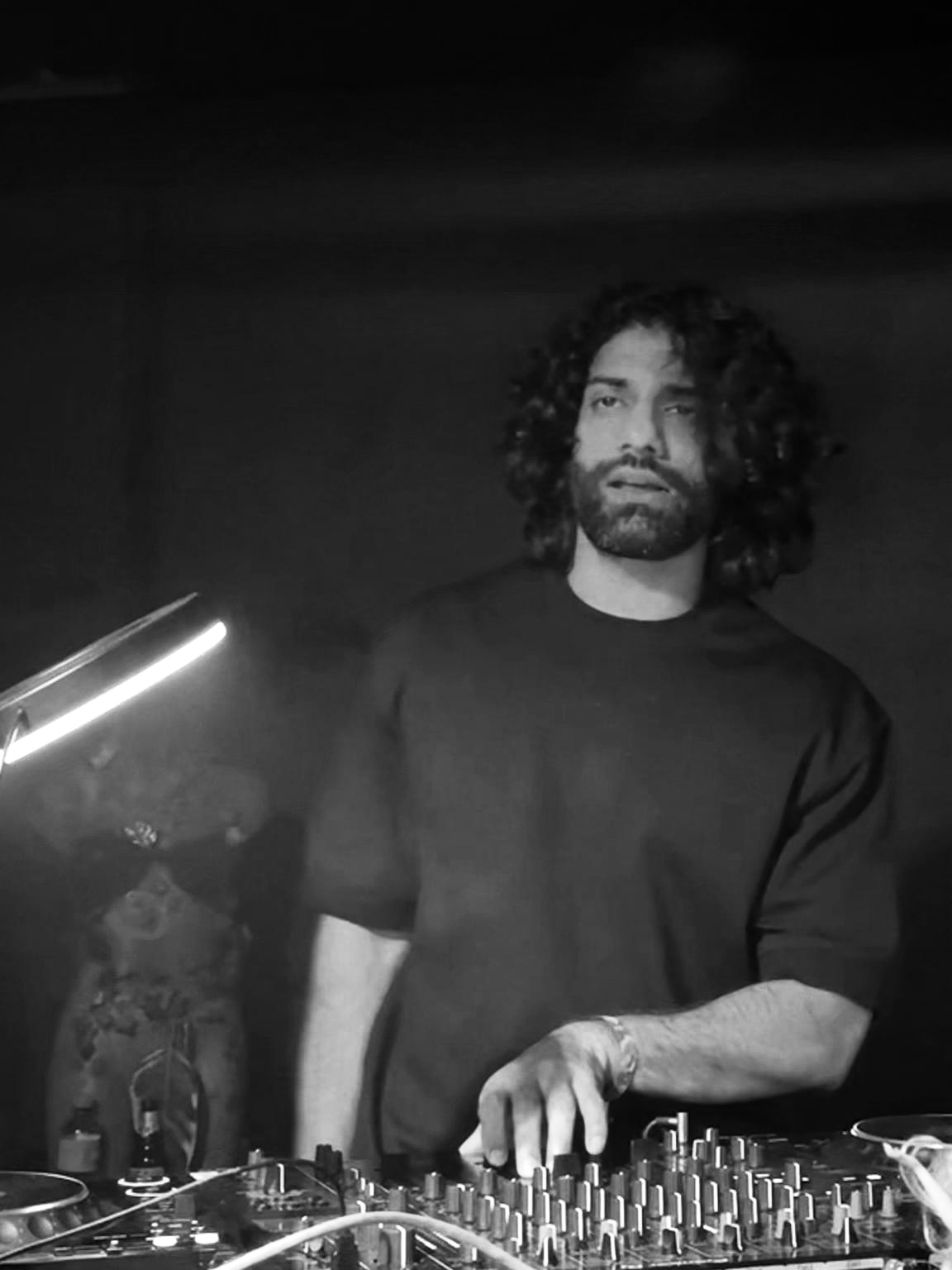 Black and white portrait of Fawad Javaid at the decks